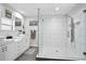 Bright bathroom featuring double sink vanity, glass shower, and modern fixtures at 343 37Th Ne Ave, St Petersburg, FL 33704