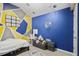 bedroom with playful wall design, and a sofa with table and chair at 343 37Th Ne Ave, St Petersburg, FL 33704