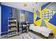 bedroom with blue walls, geometric accents, modern furniture, and playful decor at 343 37Th Ne Ave, St Petersburg, FL 33704
