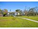 Charming home with a well-maintained front yard and lush landscaping and a beautiful lawn at 343 37Th Ne Ave, St Petersburg, FL 33704