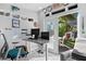 Modern office space featuring large desk, bright windows, outdoor view, and comfortable seating at 343 37Th Ne Ave, St Petersburg, FL 33704