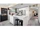 Bright kitchen with stainless steel appliances and island with bar stool seating and modern finishes at 343 37Th Ne Ave, St Petersburg, FL 33704