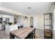 Kitchen area with stainless appliances, island, and dining area with a modern farmhouse table at 343 37Th Ne Ave, St Petersburg, FL 33704