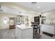 Updated kitchen features a stylish island with oven, and views into dining area and entry at 343 37Th Ne Ave, St Petersburg, FL 33704