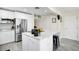 Bright, modern kitchen featuring stainless steel appliances and center island with a sleek, clean design at 343 37Th Ne Ave, St Petersburg, FL 33704