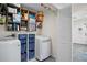 The laundry room features a modern washer and dryer with shelving and storage at 343 37Th Ne Ave, St Petersburg, FL 33704