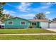 This home features a one car garage, updated windows, and a manicured lawn at 3543 Stokes Dr, Sarasota, FL 34232