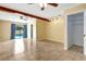 Living room featuring tile floors, ceiling fan, track lighting and sliding doors at 3543 Stokes Dr, Sarasota, FL 34232