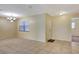 Open living area featuring tile floors, large window, and modern ceiling fan at 3543 Stokes Dr, Sarasota, FL 34232