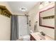 Bathroom featuring shower, vanity, and neutral color palette at 37713 Florida Ave, Dade City, FL 33525
