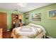 Bedroom featuring a desk, quilt, and window offering natural light at 37713 Florida Ave, Dade City, FL 33525