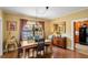 Dining room featuring wood table, chandelier, and view of the kitchen at 37713 Florida Ave, Dade City, FL 33525