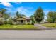 Charming single-story home with landscaped front yard and welcoming porch at 37713 Florida Ave, Dade City, FL 33525