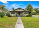 Inviting home with well-kept lawn, front porch, and charming curb appeal at 37713 Florida Ave, Dade City, FL 33525