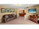 Spacious living room with tile flooring, neutral paint, and easy access to the kitchen at 37713 Florida Ave, Dade City, FL 33525