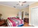 Bedroom with rustic details, wood floors, and trunk at the foot of the bed at 37713 Florida Ave, Dade City, FL 33525