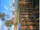 This backyard has grass and a wood fence at 402 Mary St, Punta Gorda, FL 33950