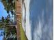 A backyard with grass and a wood fence at 402 Mary St, Punta Gorda, FL 33950