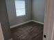 Bedroom with gray walls, a window and vinyl floors at 402 Mary St, Punta Gorda, FL 33950