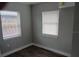 Bedroom with gray walls, two windows and vinyl floors at 402 Mary St, Punta Gorda, FL 33950
