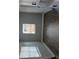 The living room has neutral paint and wood-look flooring at 402 Mary St, Punta Gorda, FL 33950