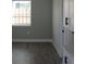The living room has neutral paint and wood-look flooring at 402 Mary St, Punta Gorda, FL 33950