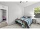 Comfortable bedroom with a ceiling fan, a window, a closet, and light colored laminate floors at 4440 58Th N Ave, St Petersburg, FL 33714