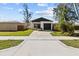 Charming single-Gathering home featuring a well-kept lawn, driveway, and convenient garage at 4440 58Th N Ave, St Petersburg, FL 33714