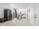 Spacious kitchen with stainless steel appliances, light gray cabinets, and open floor plan at 4440 58Th N Ave, St Petersburg, FL 33714