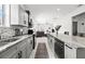 Modern kitchen with stainless steel appliances, granite countertops, and an open layout at 4440 58Th N Ave, St Petersburg, FL 33714