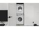 Conveniently stacked washer and dryer appliances for space-saving laundry at 4440 58Th N Ave, St Petersburg, FL 33714