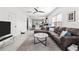 Open-concept living room flowing into the kitchen area, with a neutral palette and modern furnishings at 4440 58Th N Ave, St Petersburg, FL 33714