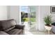 Living area with sliding glass doors leading to the backyard and natural light at 4440 58Th N Ave, St Petersburg, FL 33714