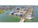 Aerial view of a waterfront condominium community, showcasing water access and nearby amenities at 500 Treasure Island Cswy # 207, Treasure Island, FL 33706