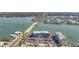 Aerial view showcasing condo buildings next to the water, featuring a nearby bridge and roadways at 500 Treasure Island Cswy # 207, Treasure Island, FL 33706