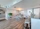 Dining room with stylish table and chairs, modern lighting, and decor that creates a warm and inviting atmosphere at 500 Treasure Island Cswy # 207, Treasure Island, FL 33706