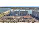 Waterfront condo building with a parking area, bay views and a bridge connecting to other land at 500 Treasure Island Cswy # 207, Treasure Island, FL 33706