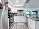 Bright, modern kitchen features stainless steel appliances and granite countertops at 500 Treasure Island Cswy # 207, Treasure Island, FL 33706