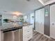 Living space features luxury vinyl plank flooring, closet, kitchen, and dining area at 500 Treasure Island Cswy # 207, Treasure Island, FL 33706