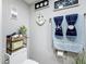Cozy toilet area with decoratives on the wall and plant at 500 Treasure Island Cswy # 207, Treasure Island, FL 33706