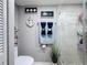 Cozy toilet area with decoratives on the wall and plant at 500 Treasure Island Cswy # 207, Treasure Island, FL 33706