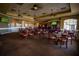 A casual dining area with tables and a bar, perfect for relaxed gatherings and socializing at 5021 Championship Cup Ln, Spring Hill, FL 34609