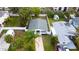 Aerial view of a home with a well-maintained roof and a lush green yard at 715 Virginia Ave, Tarpon Springs, FL 34689