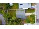 A bird's eye view captures this home's neatly maintained yard and proximity to neighborhood amenities at 715 Virginia Ave, Tarpon Springs, FL 34689