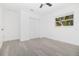 Comfortable bedroom with hardwood floors, large windows, closet, and ample natural light at 715 Virginia Ave, Tarpon Springs, FL 34689