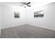 Bright, well lit room with two large windows and wood-look flooring at 715 Virginia Ave, Tarpon Springs, FL 34689