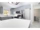 Renovated kitchen featuring stainless steel appliances, ample counter space and sleek gray cabinetry for storage at 715 Virginia Ave, Tarpon Springs, FL 34689