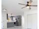 Open living space showcasing updated kitchen and stainless steel appliances with modern grey color scheme at 715 Virginia Ave, Tarpon Springs, FL 34689