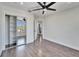 Well-lit bedroom with hardwood floors and sliding door closet at 7525 Forest Mere Dr, Riverview, FL 33578