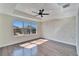 Spacious bedroom with a tray ceiling, recessed lighting, and an abundance of natural light at 7525 Forest Mere Dr, Riverview, FL 33578